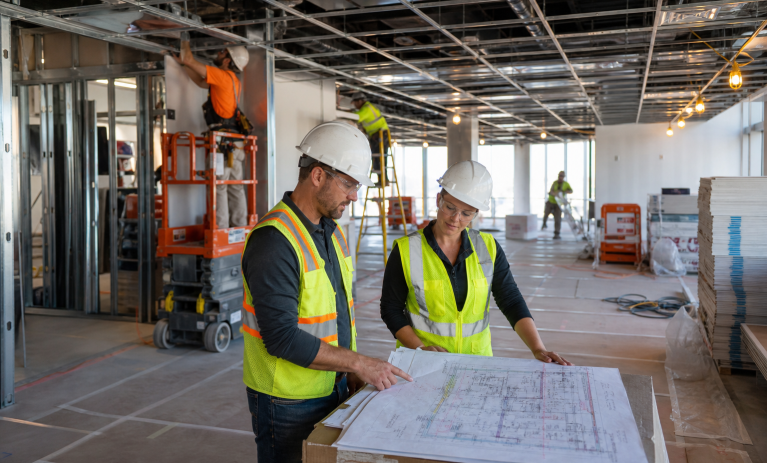 Blue Sky Active Commercial Interior Commercial interior build out in progress with team reviewing plans
