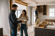 Residential renovation in progress with contractor reviewing finishes